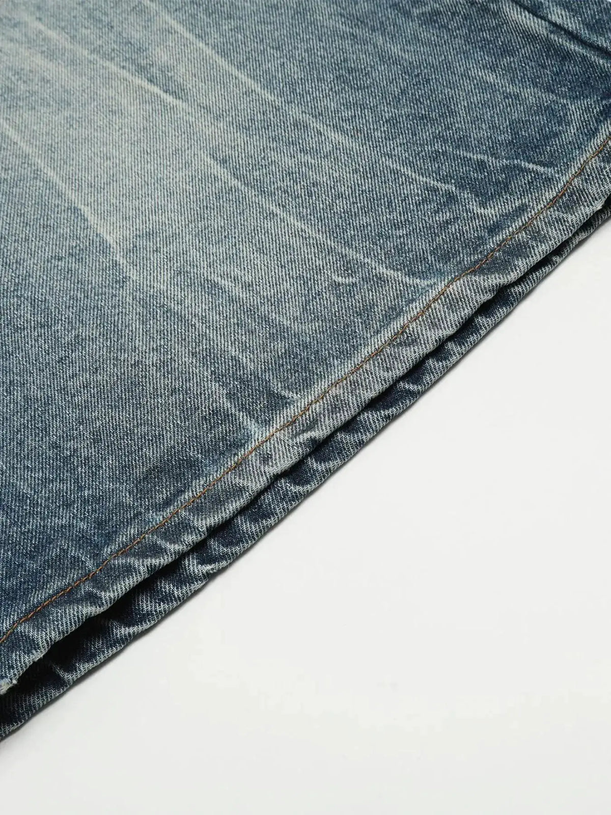 Mens washed light-blue denim shorts with visible orange stitching along the hem.