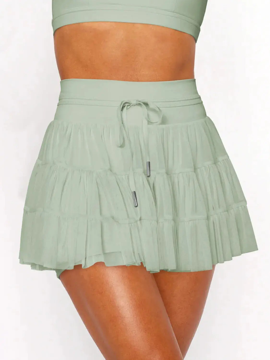 Ruched mini skort with drawstring waist by Trendsi in sage green, tiered.