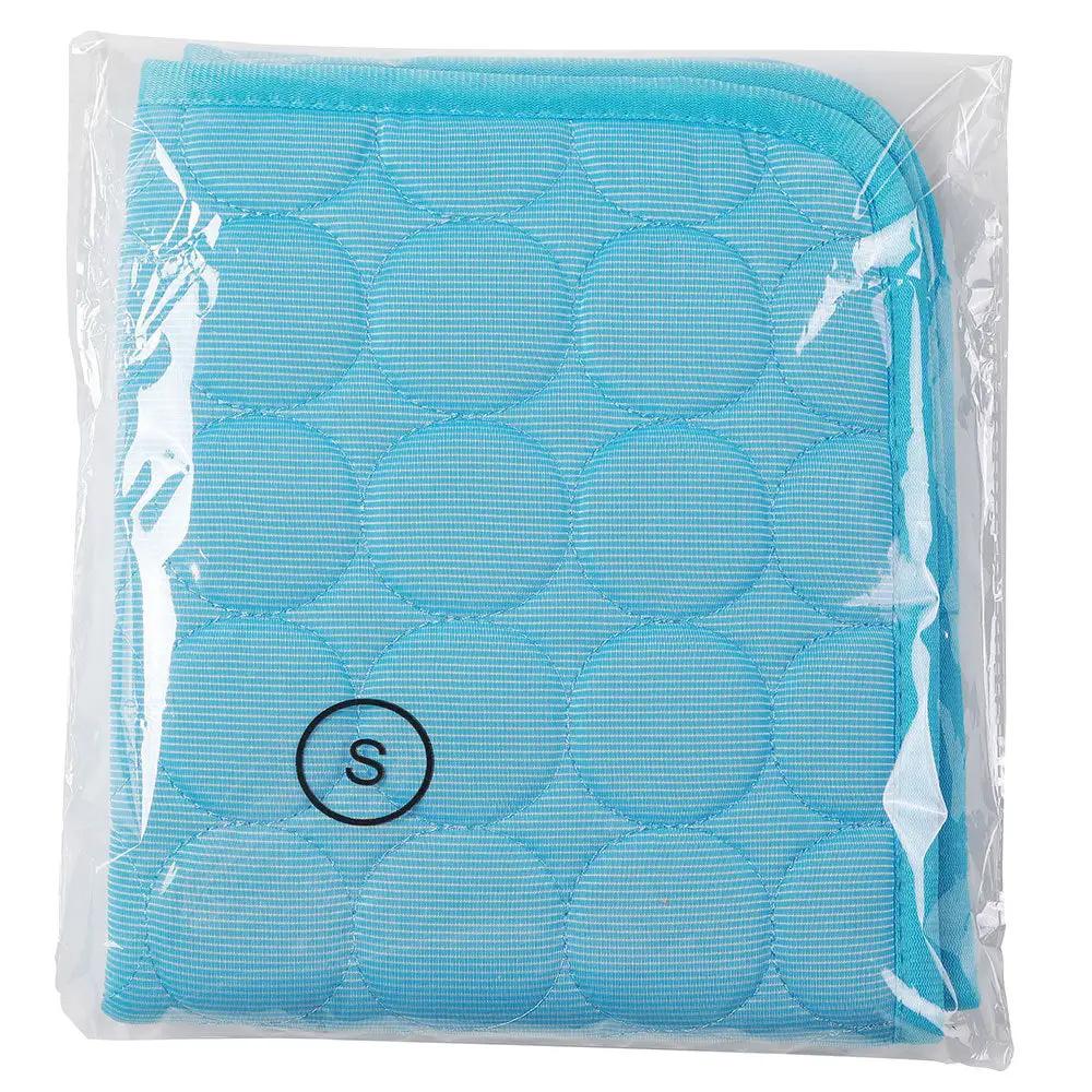 Blue quilted dog cooling mat, S size, in plastic packaging