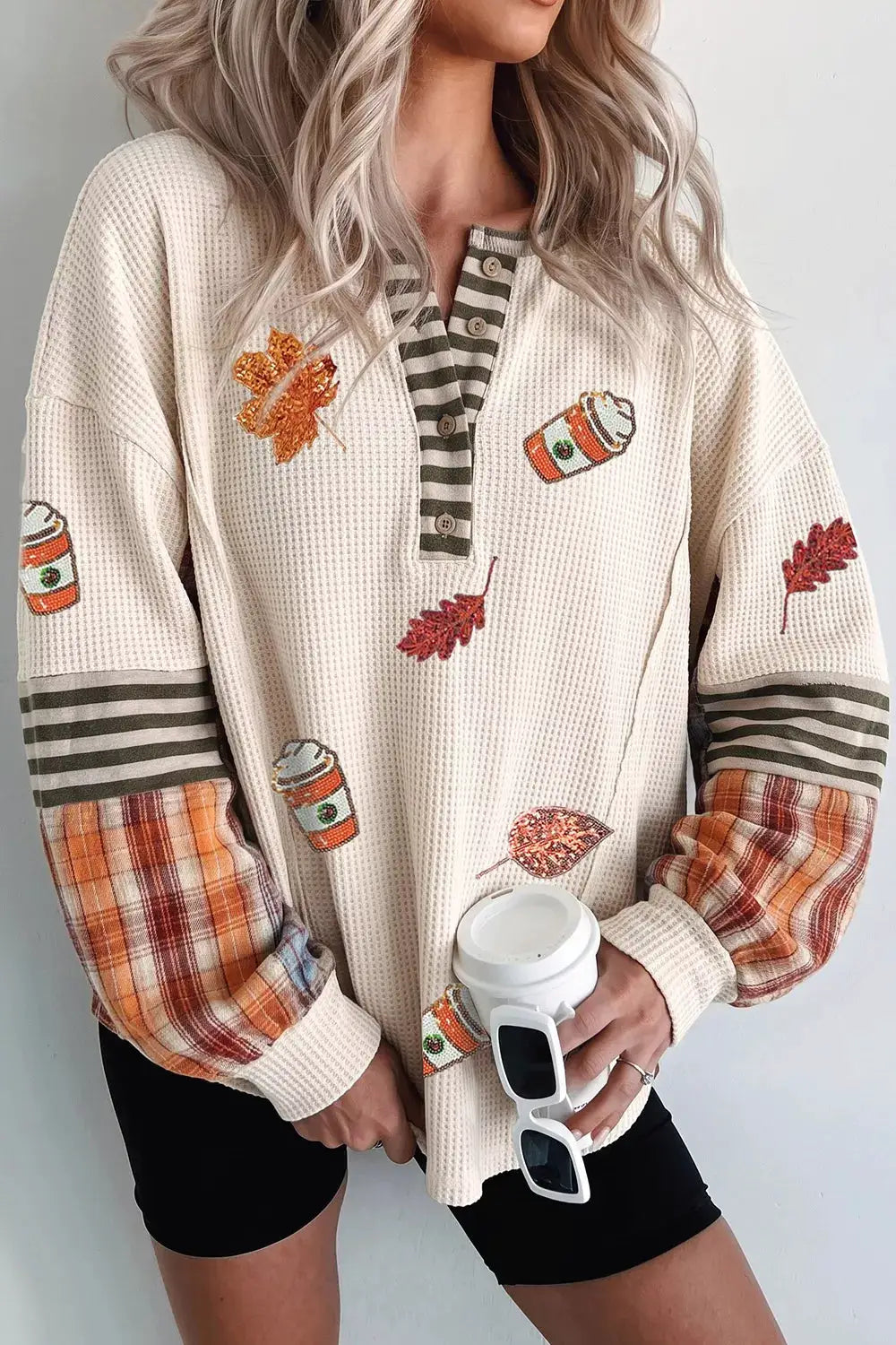 Sequin Autumn Leaf & Coffee Cup Waffle Knit Top in cream with striped placket and plaid-orange sleeves
