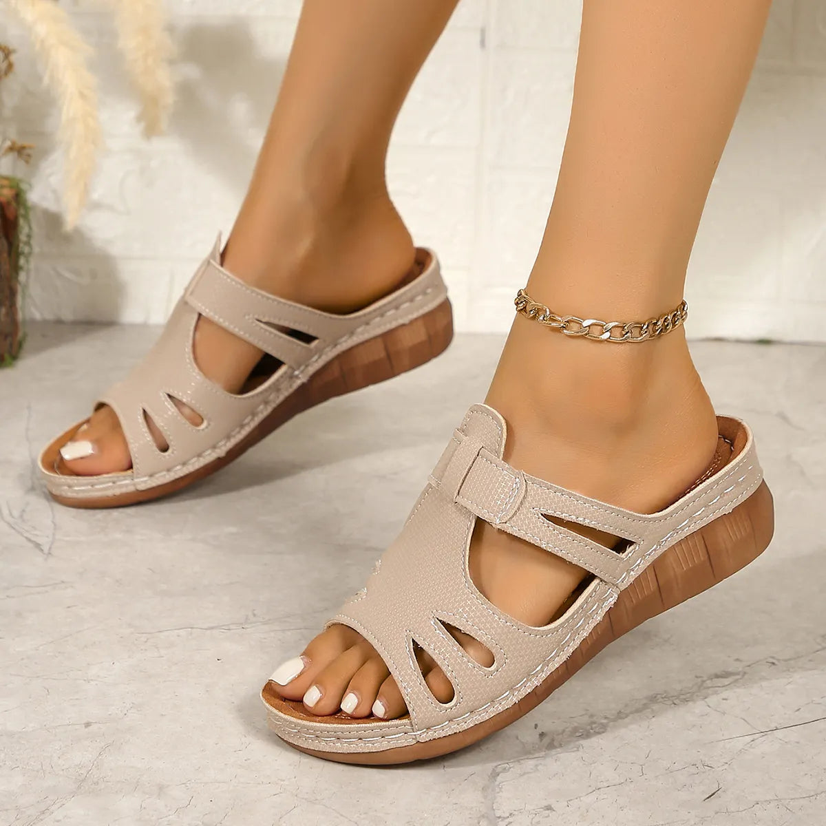 Pair of cutout open-toe wedge sandals, beige faux leather
