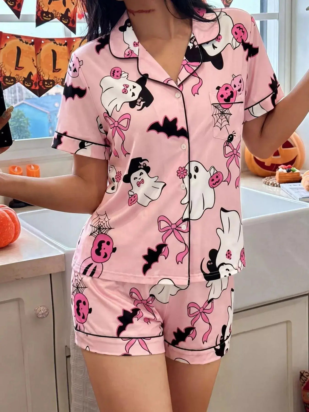 Halloween ghost print pink satin button-down top and shorts lounge set with spiderweb pocket by Trendsi