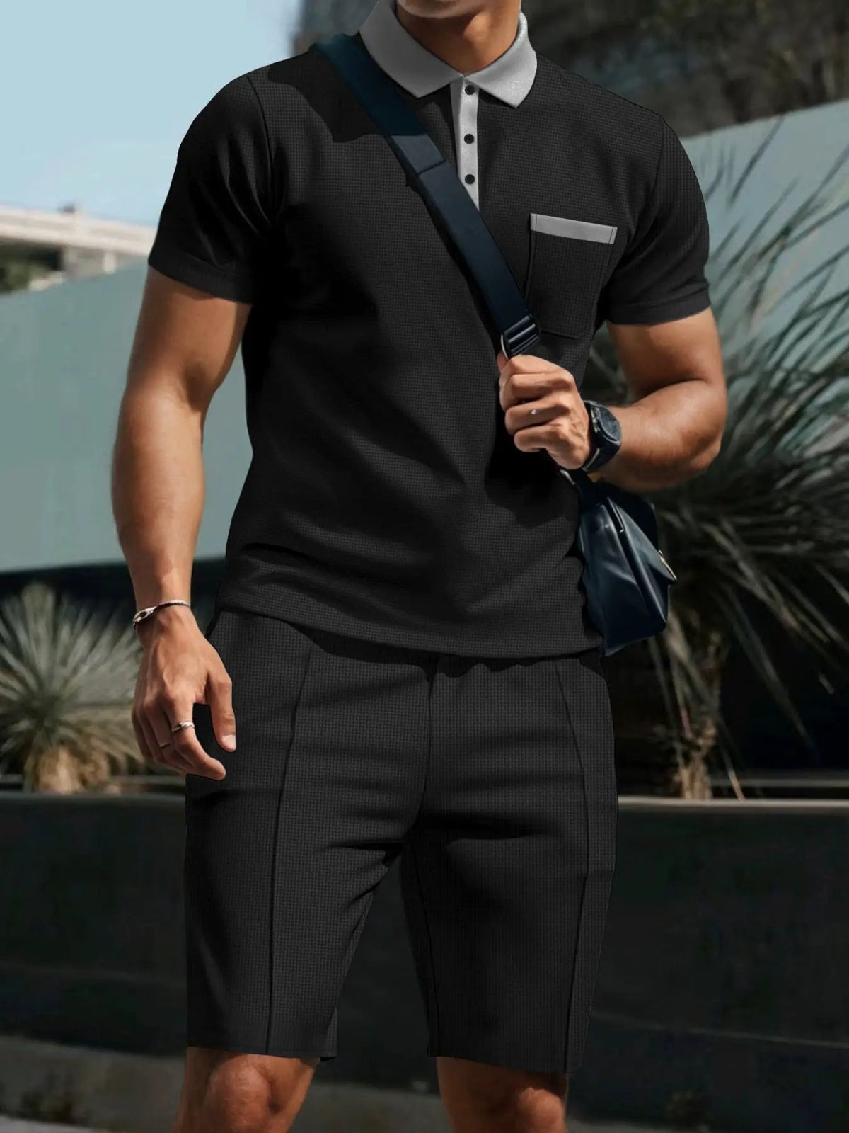 Mens black textured polo and shorts set with front chest pocket and stretch fit, Trendsi