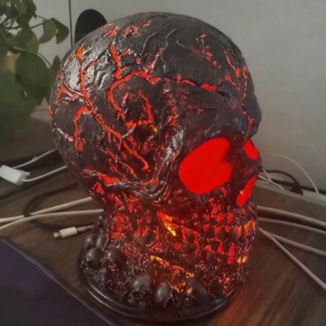 Skull desk lamp by AdTec with lava-stone texture and red LED glow for Halloween decor