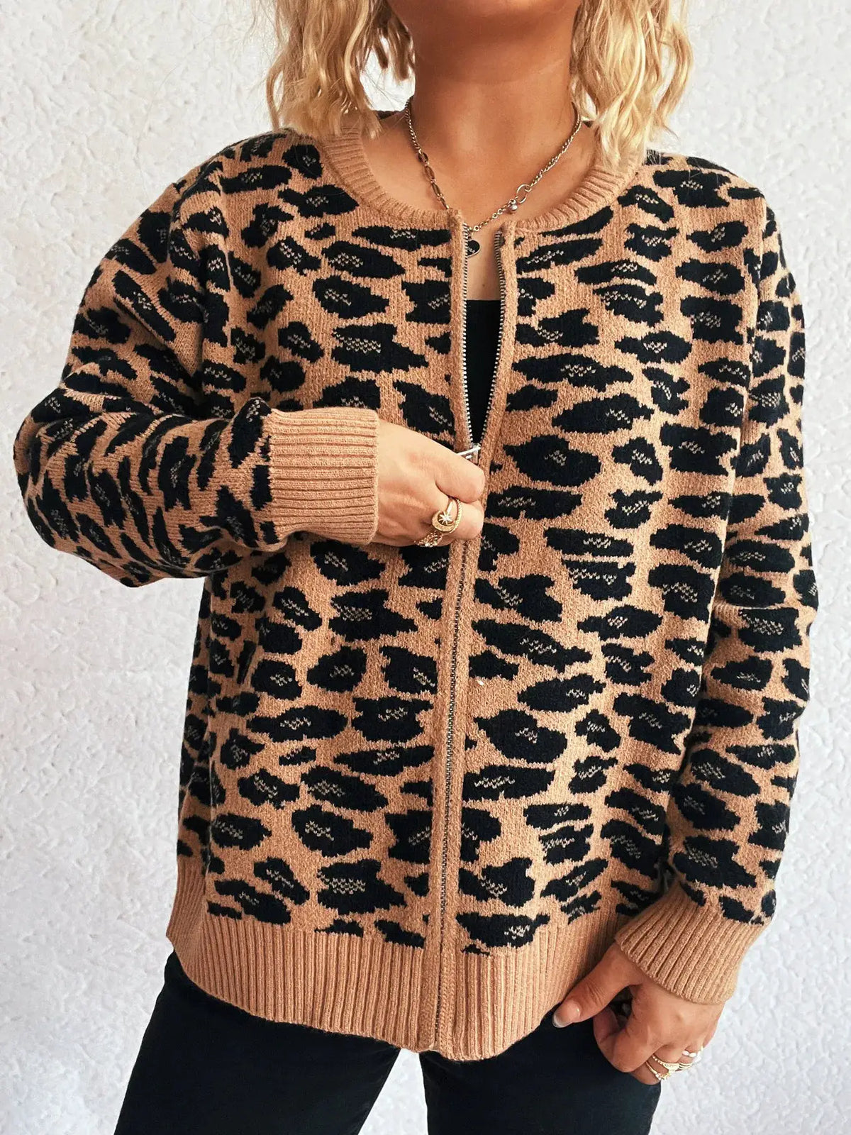 Zip-up leopard print cardigan in camel and black by Trendsi; long sleeves with ribbed cuffs and hem