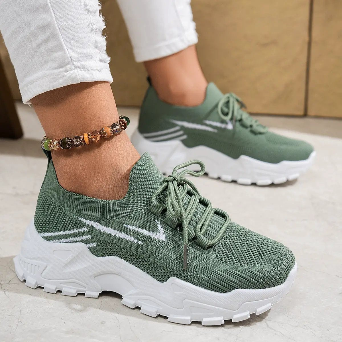 Women's casual lightweight soft-bottom sports shoes in olive green knit with white chunky soles (pair)