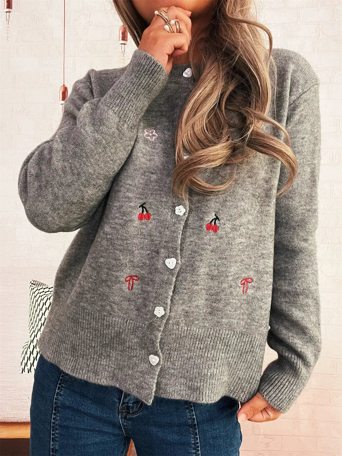 Grey ribbed knit cardigan with button-front closure and small cherry embroidery