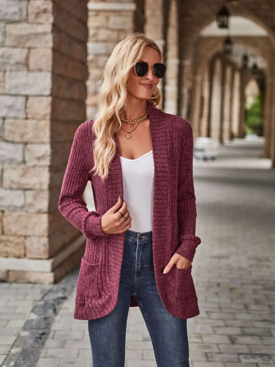 Stretchy open-front cardigan in burgundy ribbed knit with deep side pockets.