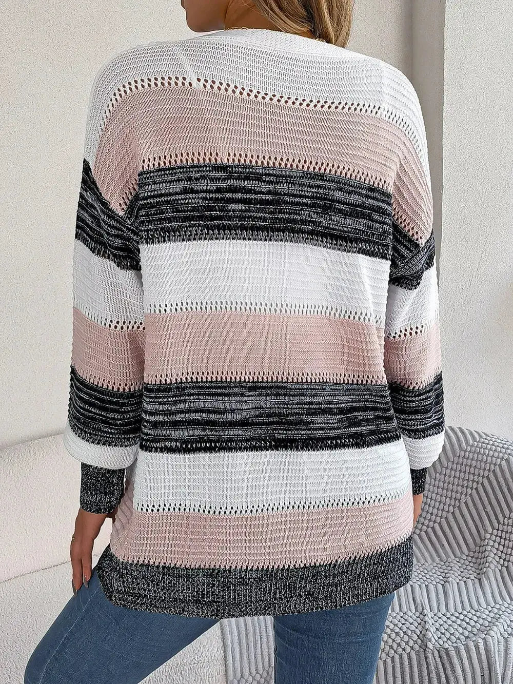 Openwork striped cardigan in white, blush pink, and black; lightweight relaxed knit with open front from Trendsi