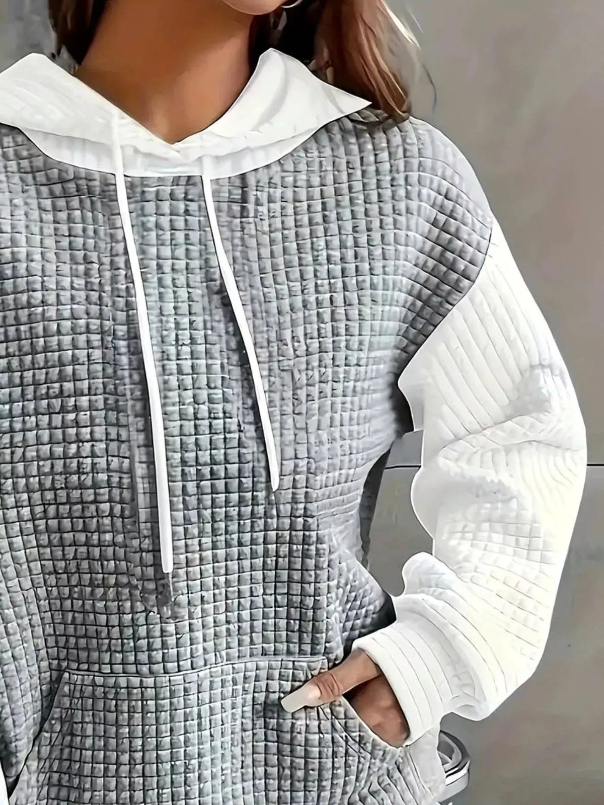 Full Size Textured Kangaroo Pocket Hoodie Plus Size by Trendsi; gray quilted front panels with white sleeves and hood