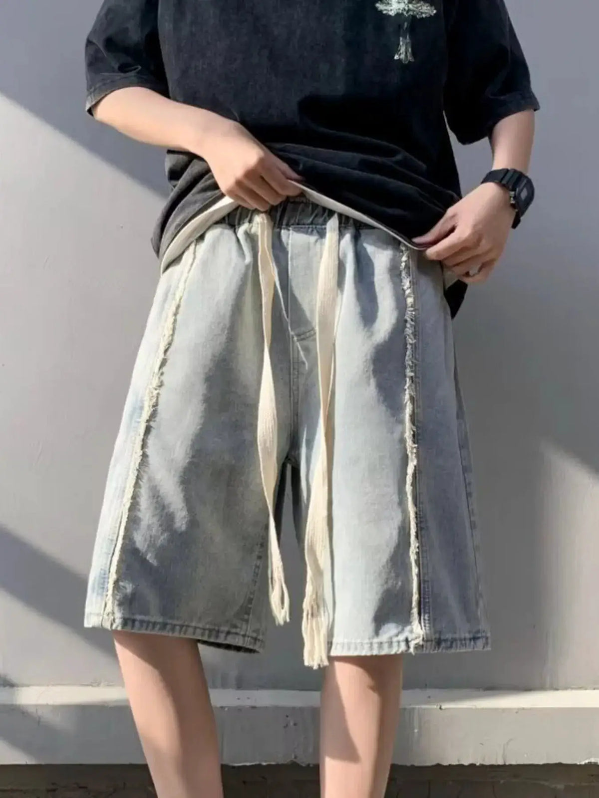 Men's plus-size light-wash denim shorts with stretch drawstring waist and pockets