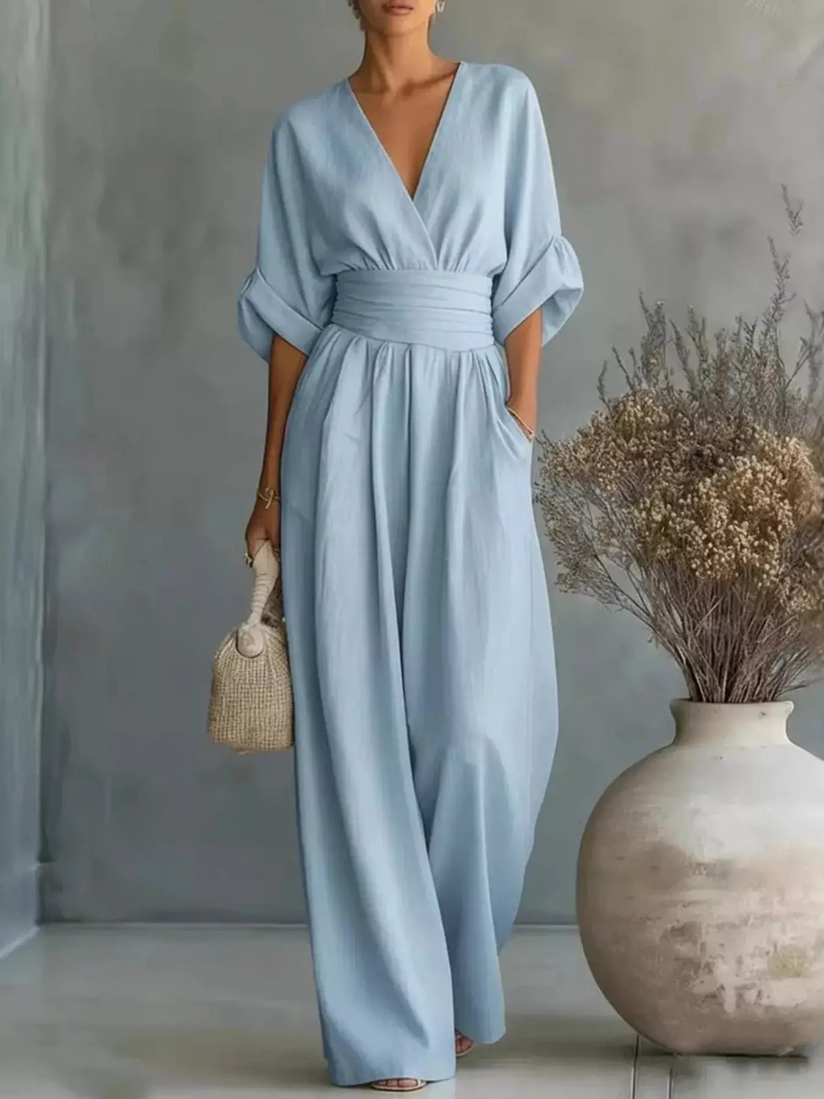 Full Size Half Sleeve Wide Leg Jumpsuit by Trendsi in light blue with wrap V-neck and ruched waist (plus size)