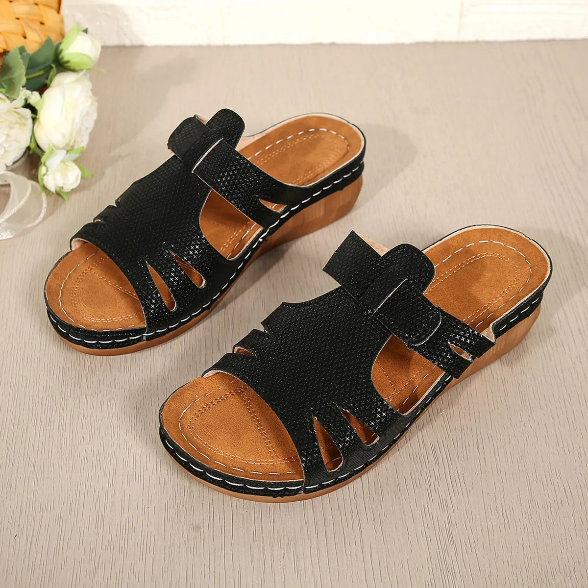 Cutout open-toe wedge sandals, black faux leather straps, tan footbed, pair (2)