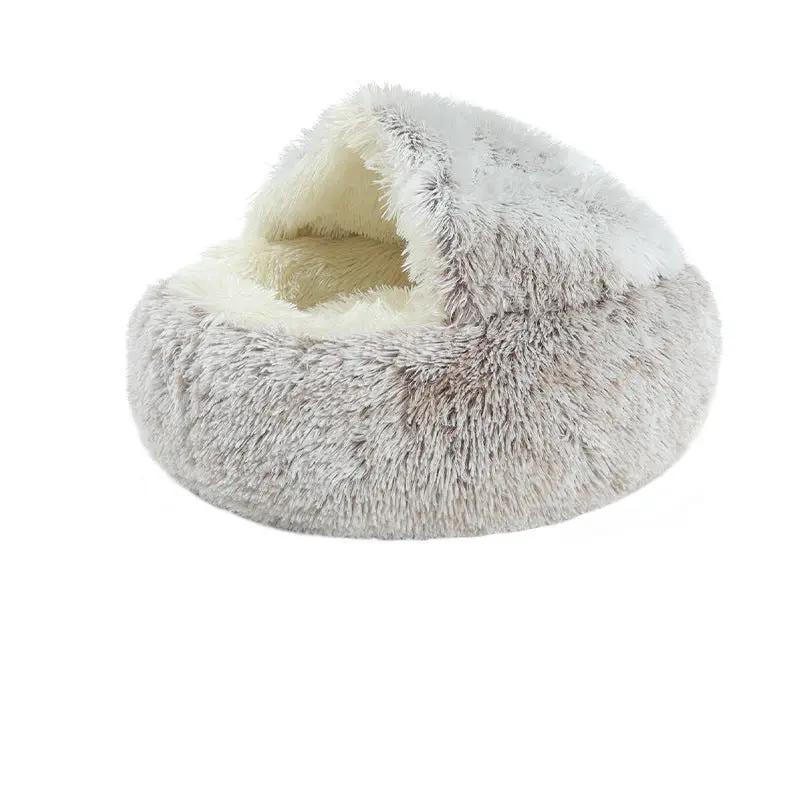 AdTec crystal velvet warm round cat bed, plush gray exterior with cream interior.