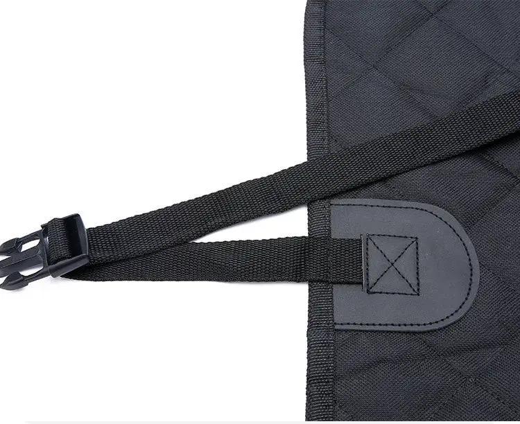 Dog car seat cover in quilted black fabric with adjustable strap and buckle