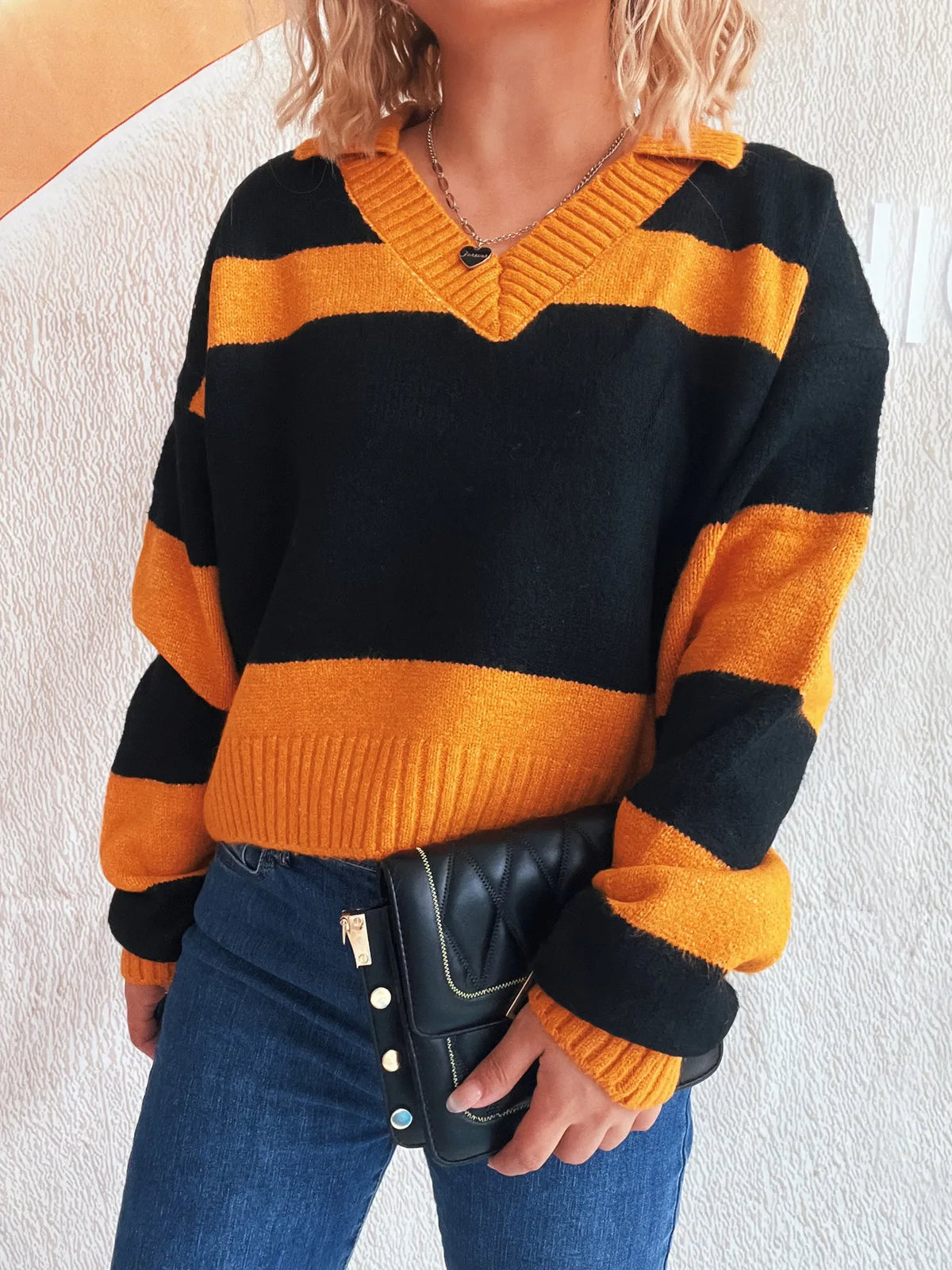 Color Block Long Sleeve Sweater in black and orange with a ribbed V-neck and soft stretch polyester blend