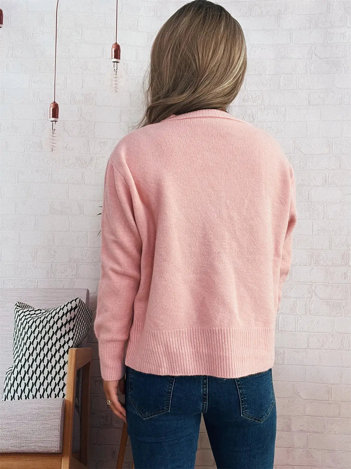 Pink ribbed knit cardigan, back view; comfy stretchy layering top