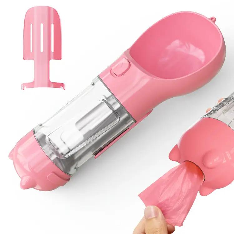 AdTec pink 3-in-1 dog water bottle with feeder bowl and bag storage for outdoor travel.
