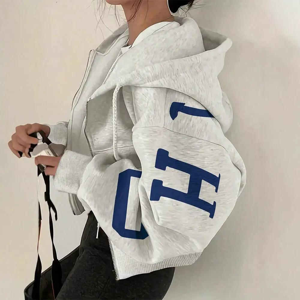 Soft full-zip hooded sweatshirt in light gray with bold blue lettering on the sleeve