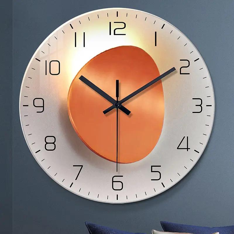 Wall-mounted decorative clock by AdTec with a silver outer dial and copper inner disk.
