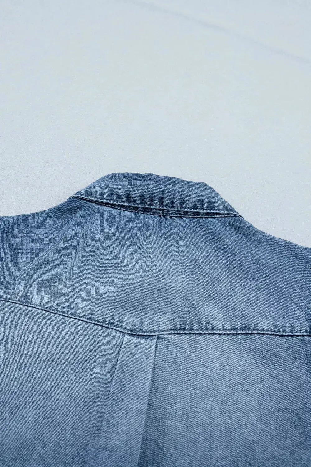 Girls lightweight denim shirt back view in light blue with collar and yoke