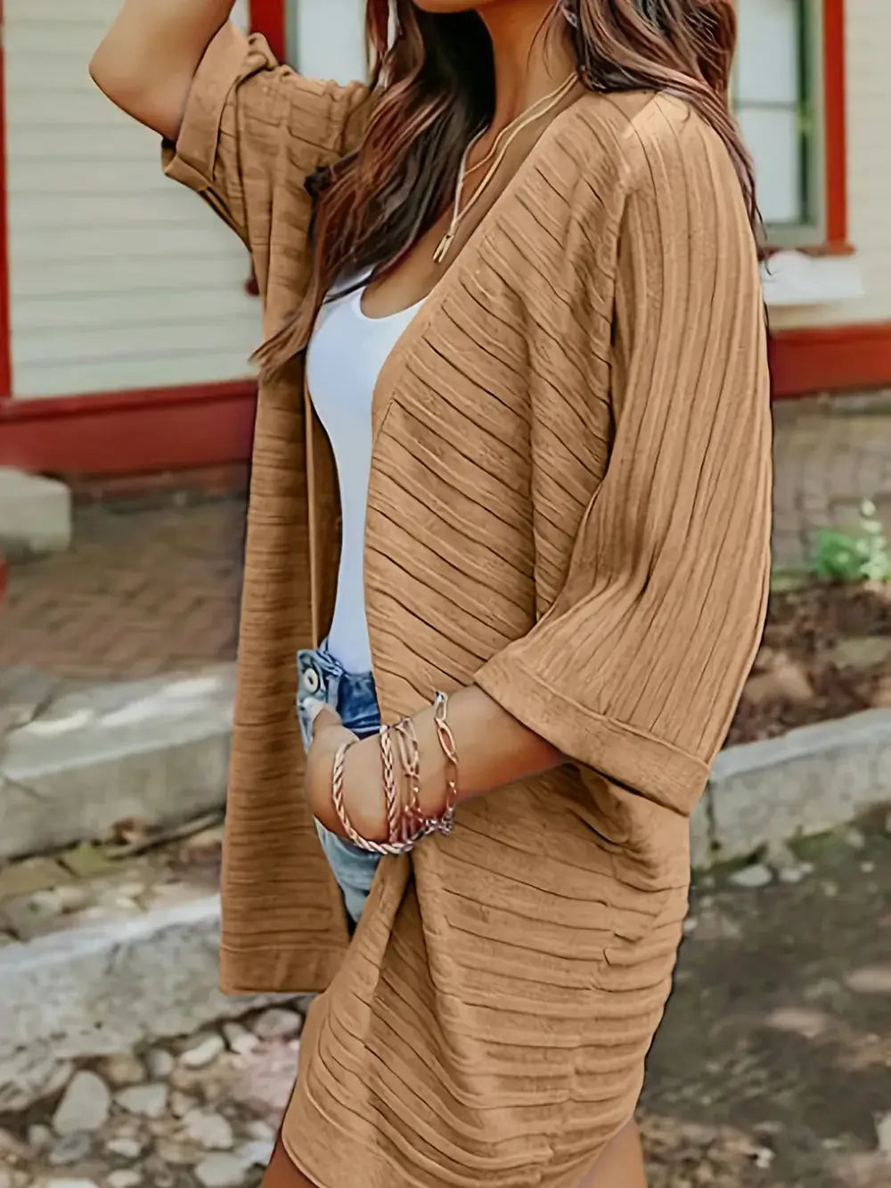 Striped open-front acrylic cardigan in tan with a relaxed, roomy fit.