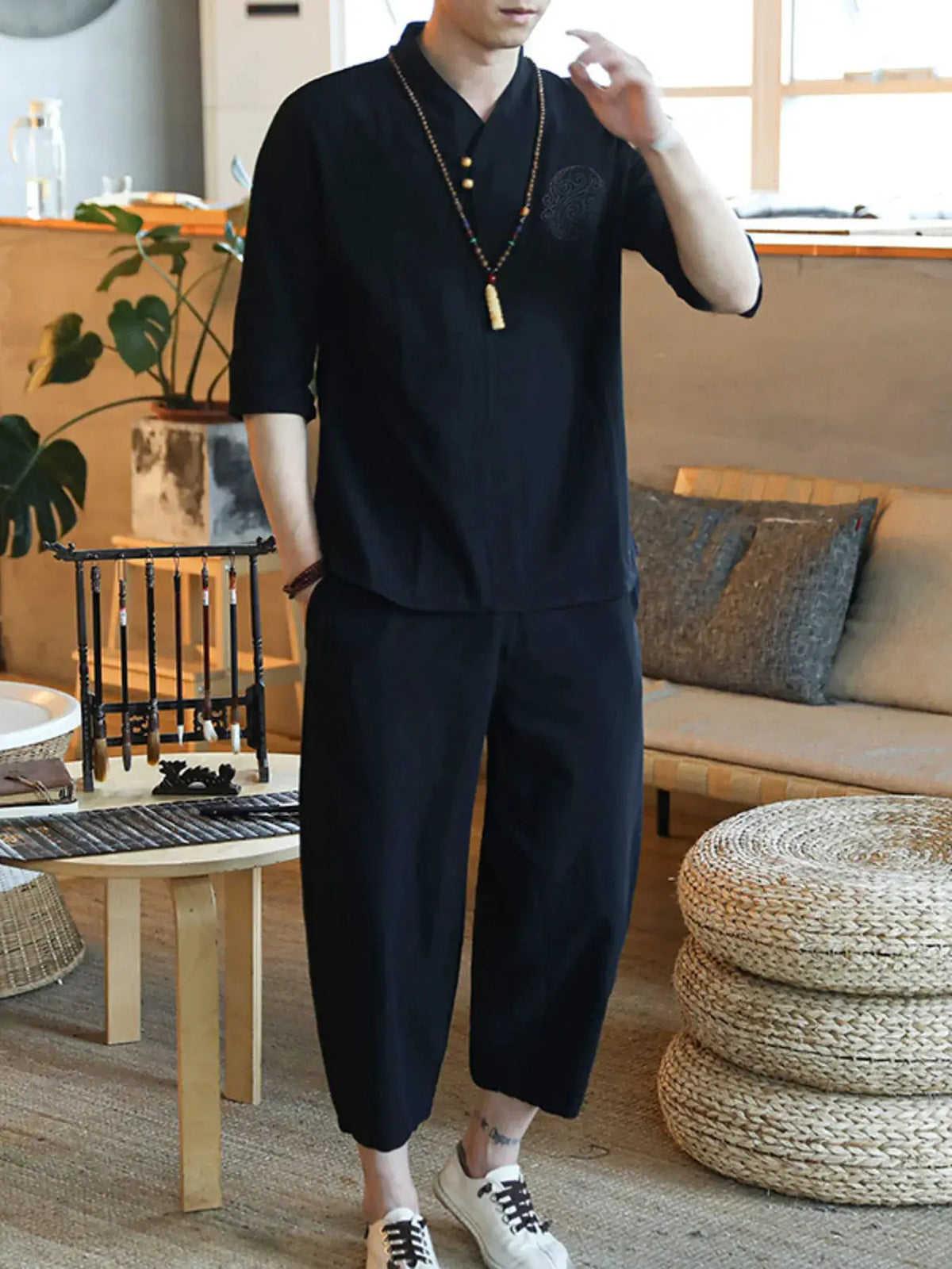 Men's plus-size black two-piece top-and-pants set with three-quarter sleeves