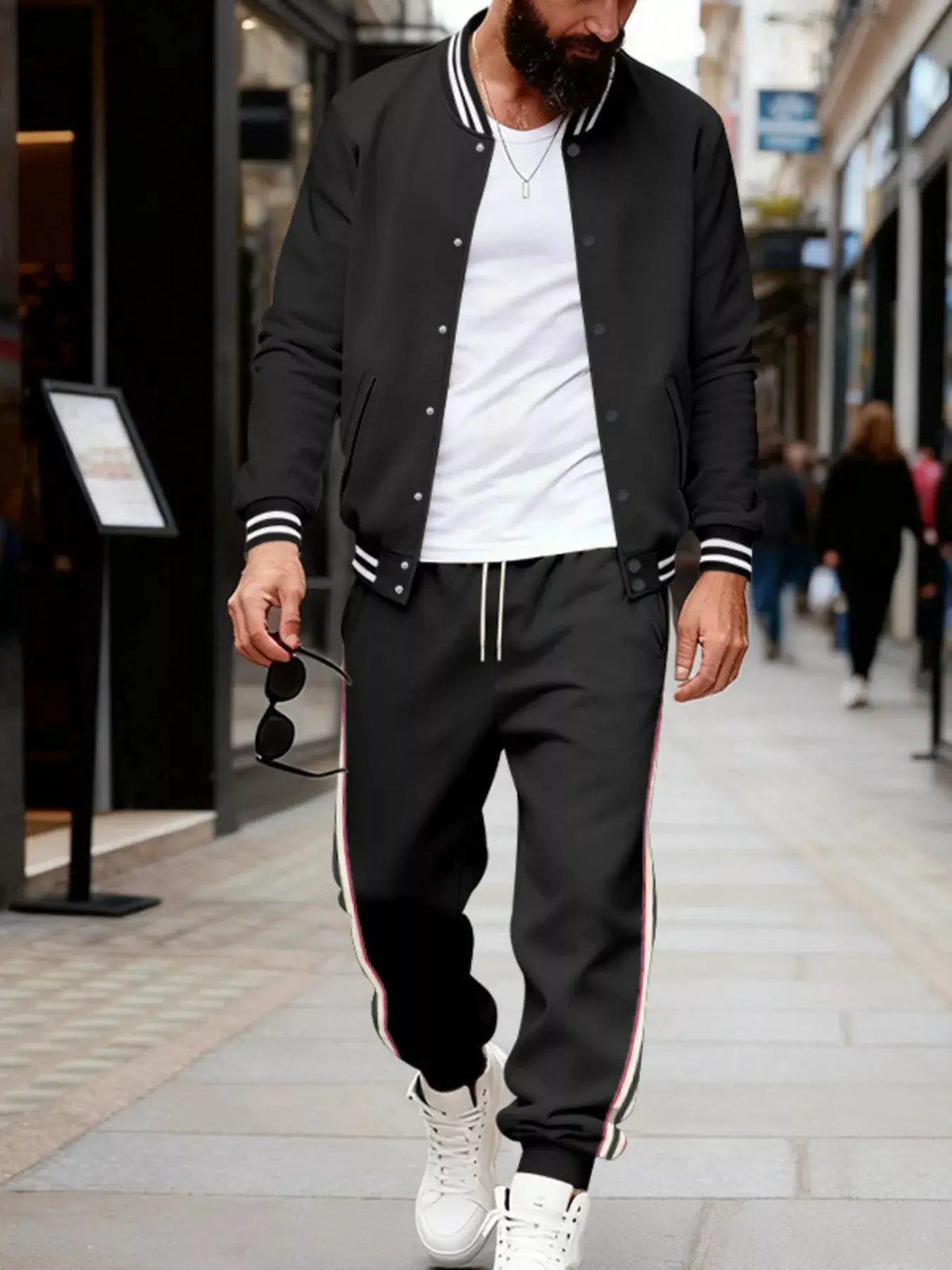 Men's black striped snap-front loungewear set with drawstring waist and pockets; white and red side piping on pants