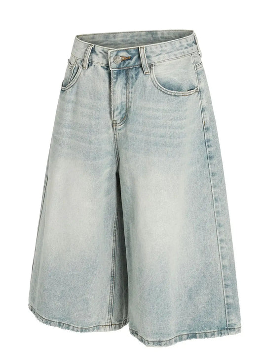 Mens wide-leg denim shorts, light wash, soft cotton, relaxed fit.
