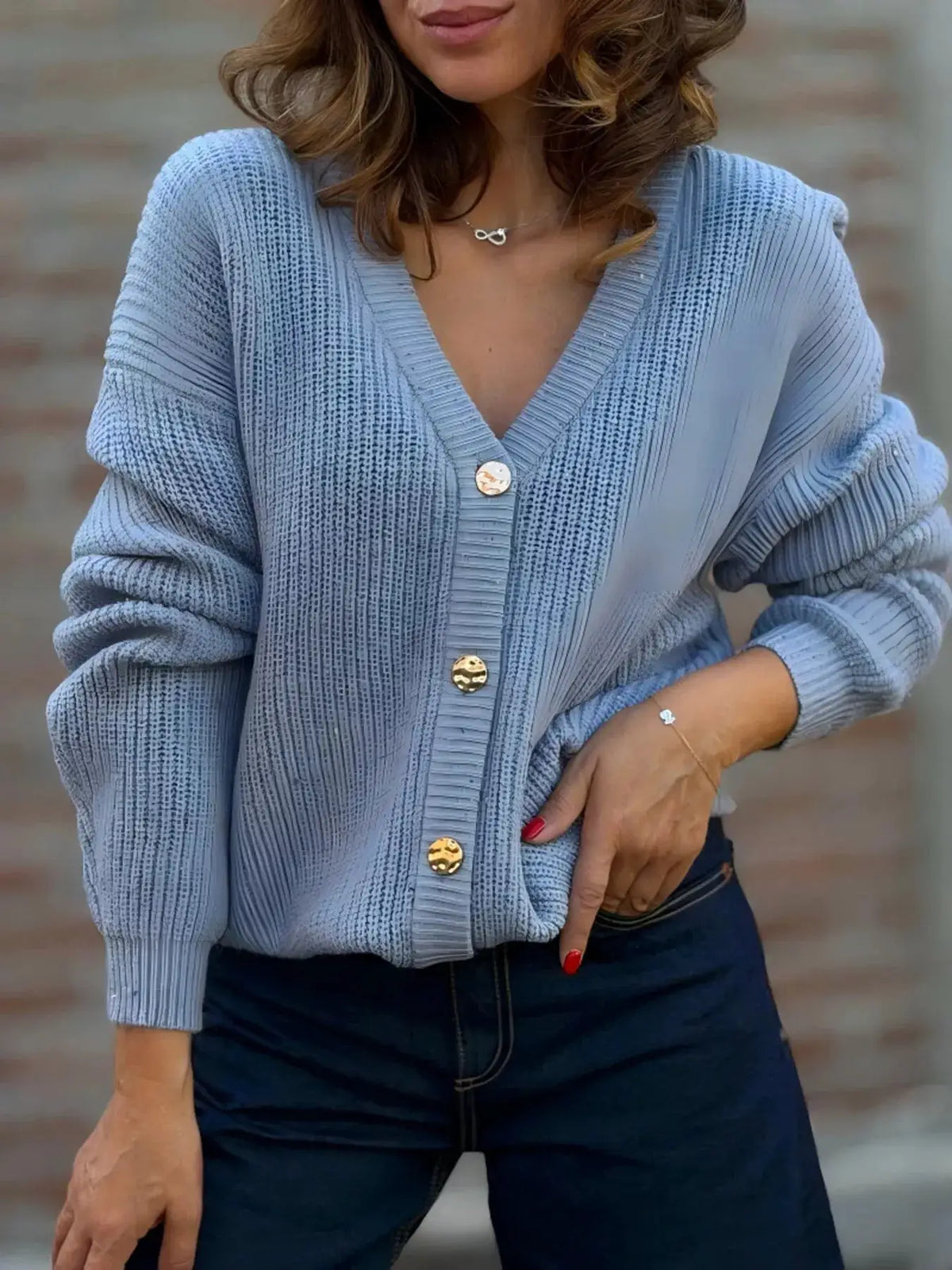 Plus size V-neck button-up knit cardigan in light blue with gold buttons and slight stretch