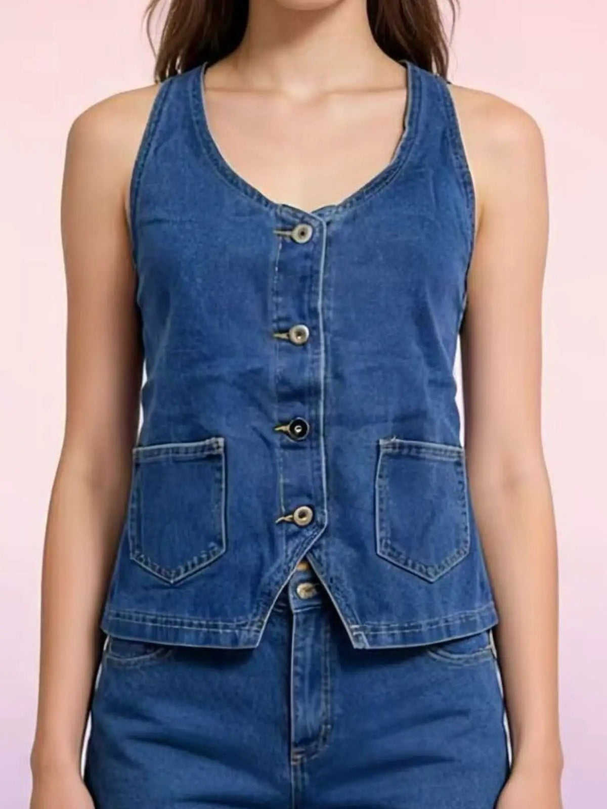 Blue denim halter-neck vest with button-front closure and two patch pockets