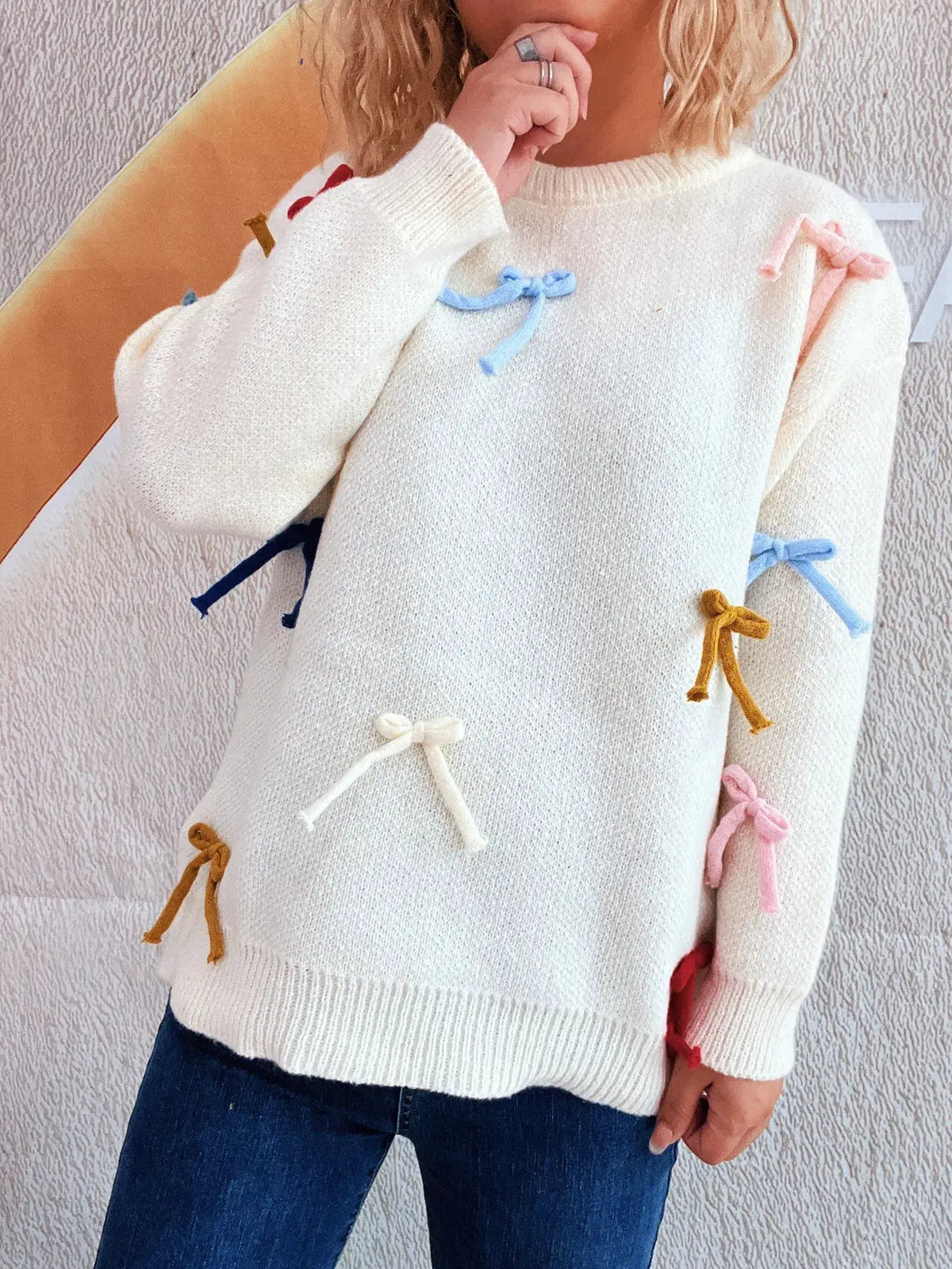Vibrant bow-accent sweater for women, off-white knit with multicolor ribbon bows