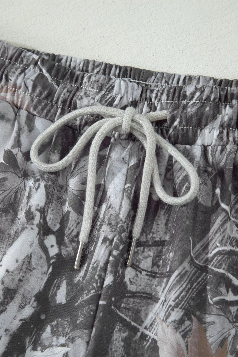 Abstract maple leaf printed shorts with gray drawstring elastic waistband