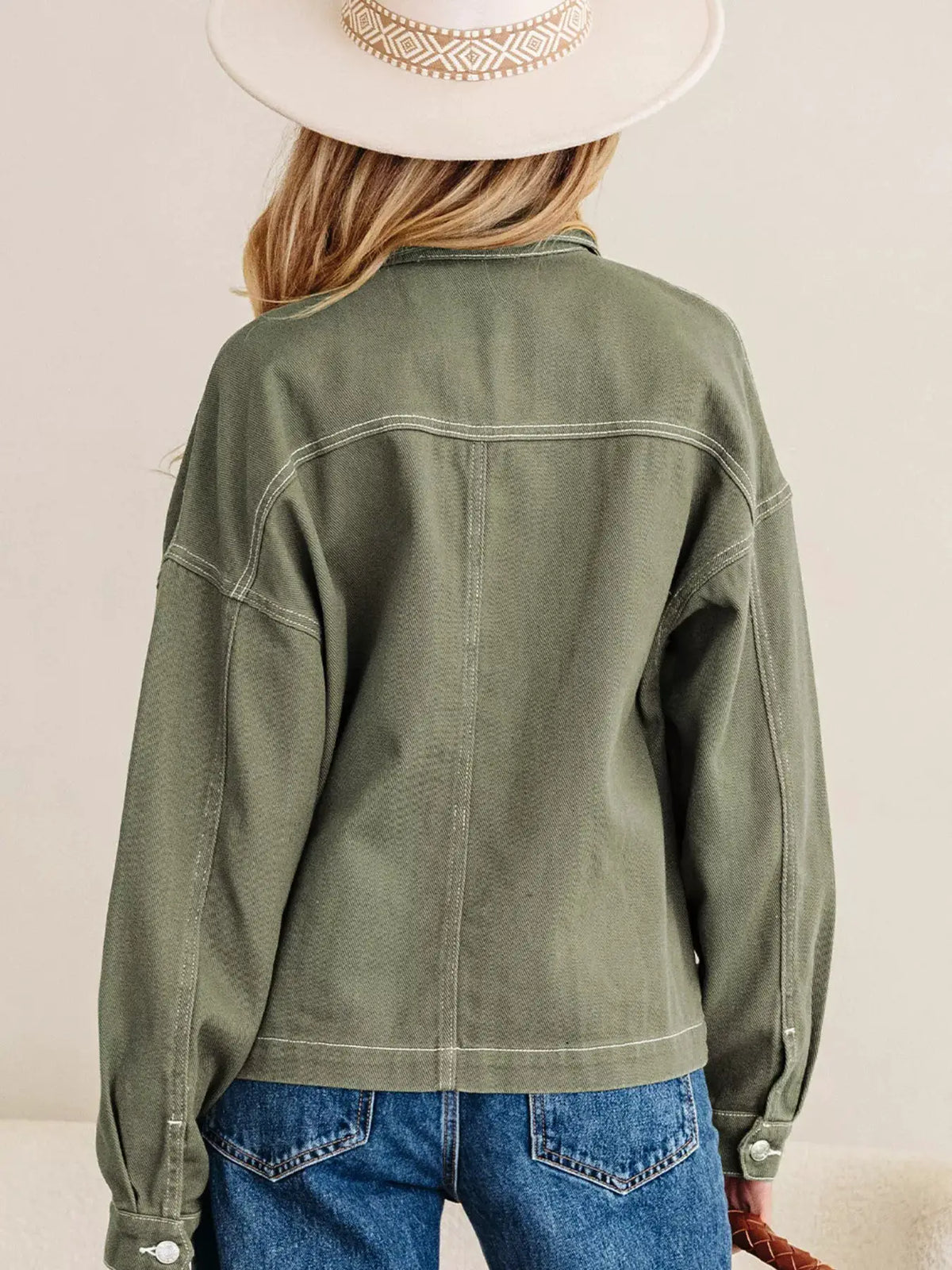 Boyfriend denim jacket in olive green with white contrast stitching, back view
