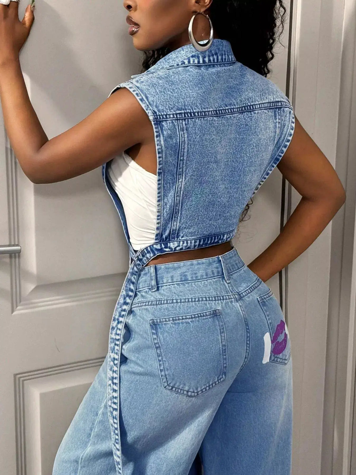 Open-front denim vest in vintage wash, cropped fit worn over a white top