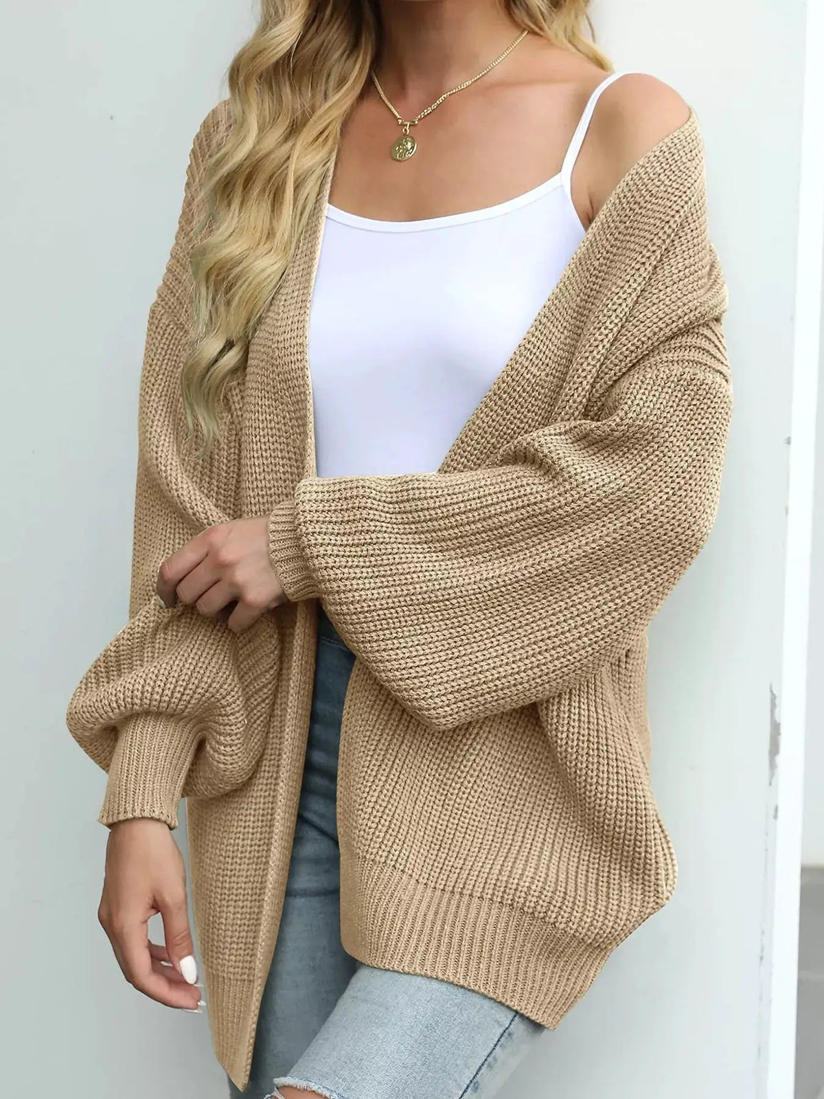 Cozy oversized chunky knit open-front cardigan in beige with lantern sleeves