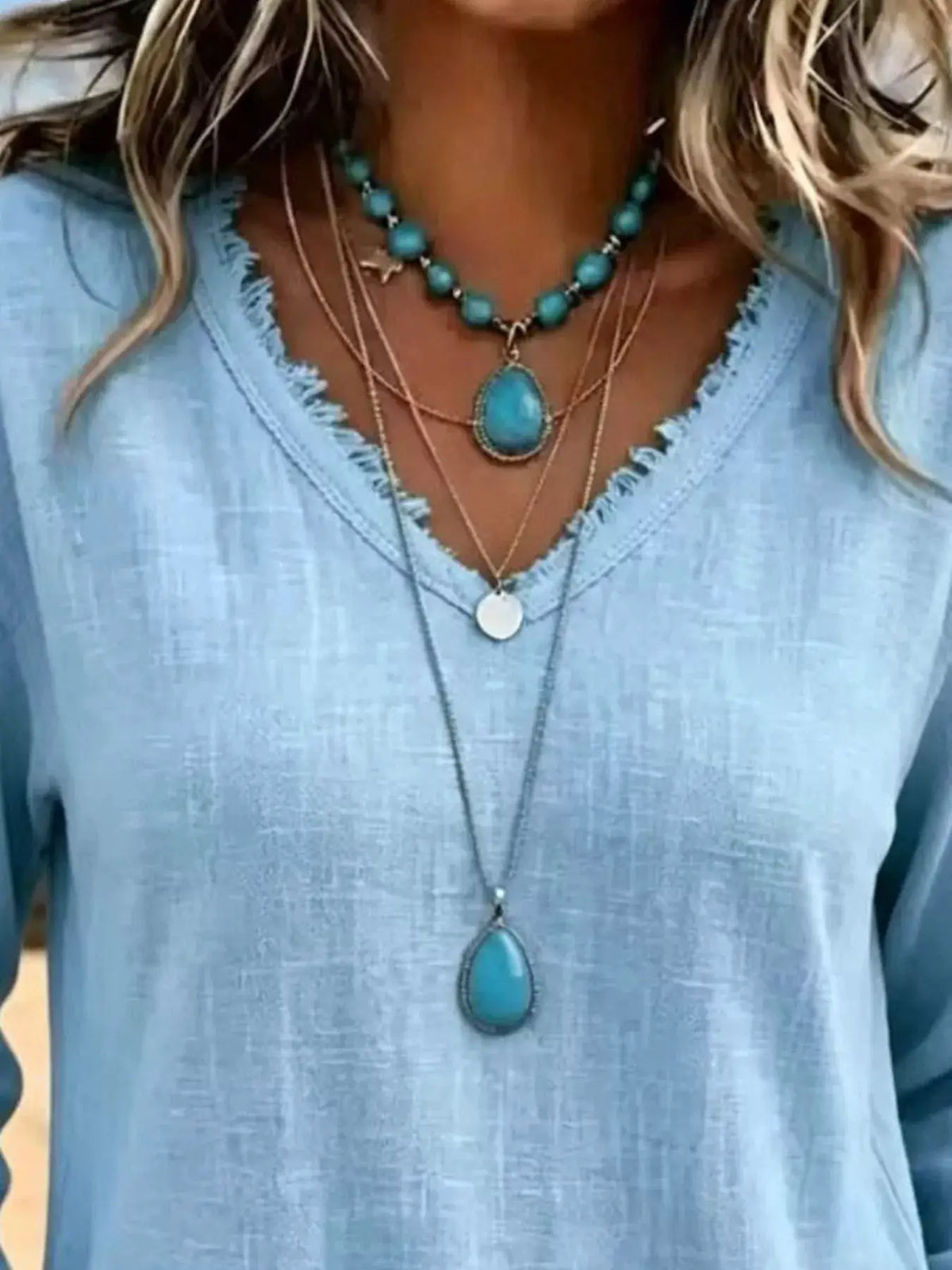 V-Neck Frayed Hem Long Sleeve T-Shirt in light blue with two turquoise necklaces