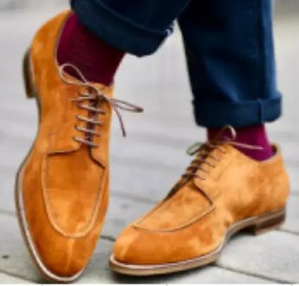 Hathaway men's refined British suede dress shoes; tan suede, lace-up Derby style pair on city sidewalk.