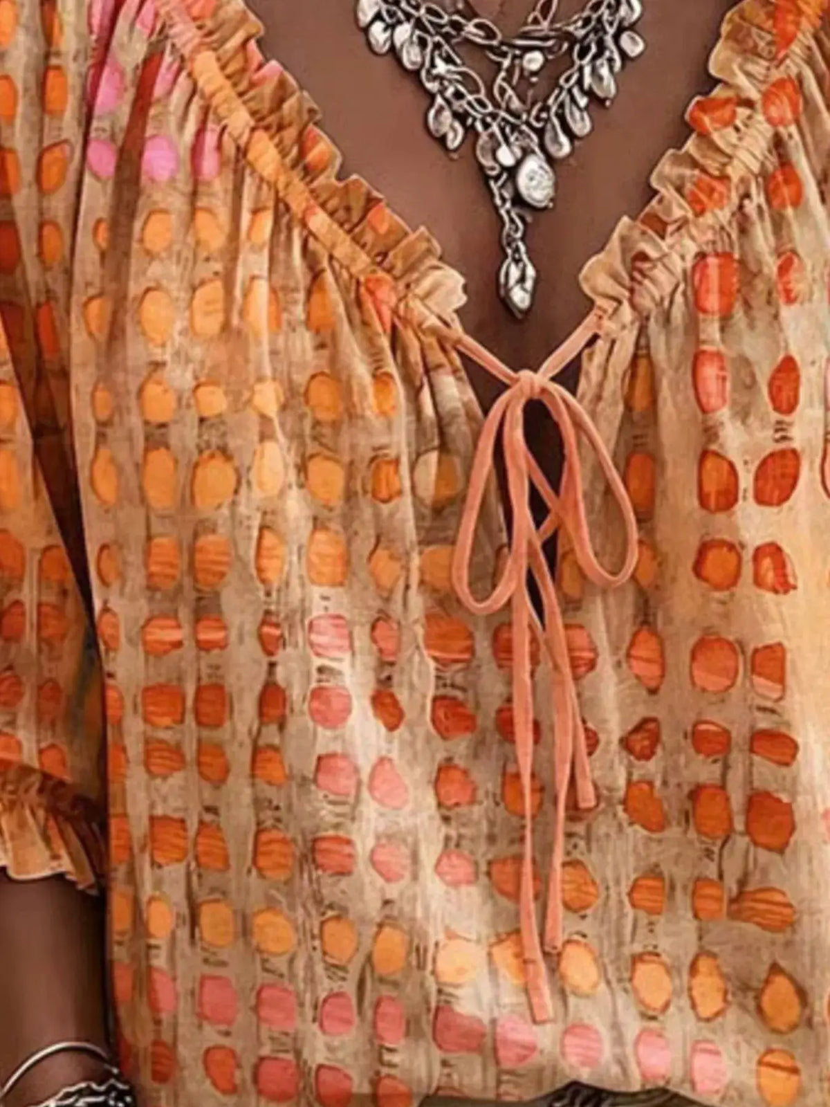 Plus-size tie-neck blouse with 3/4 sleeves in orange print, pink waist tie by Trendsi