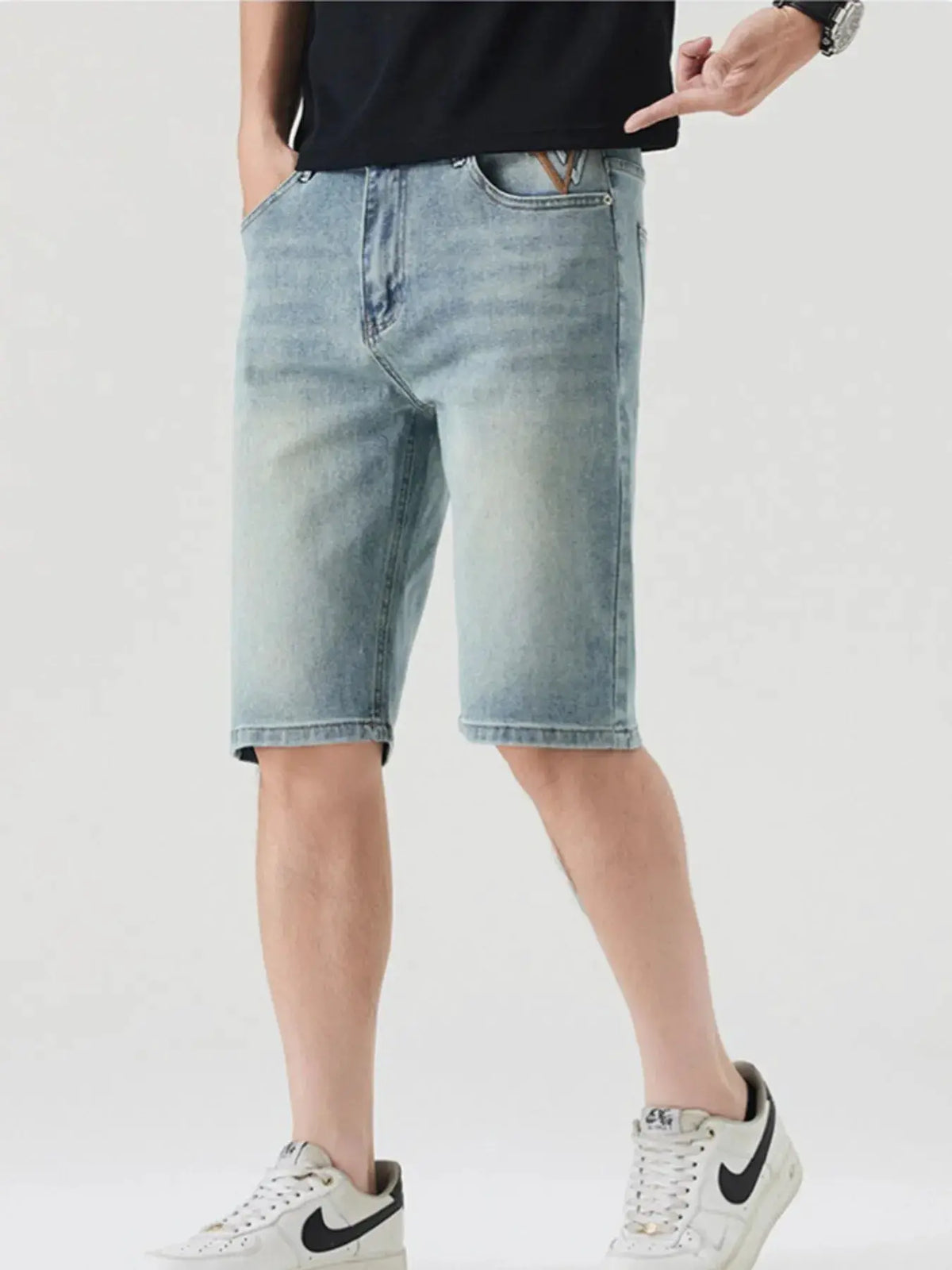 Men's casual stretch cotton denim shorts with large front pockets, light blue