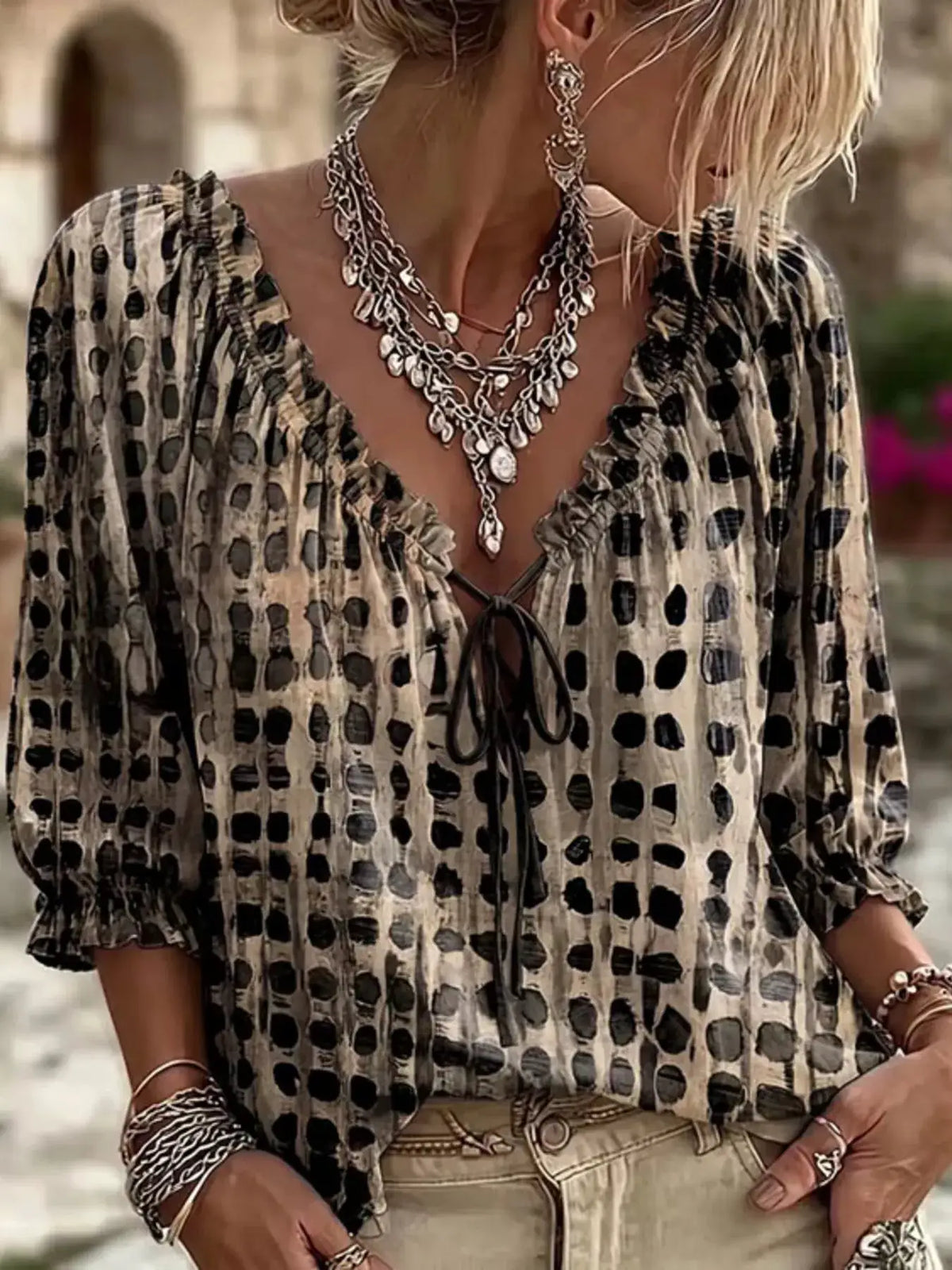 Plus-size tie-neck blouse with 3/4 sleeves in beige with black abstract print