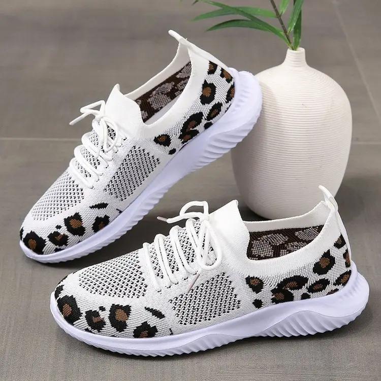 White women's leopard-print lace-up sneakers with knit upper.