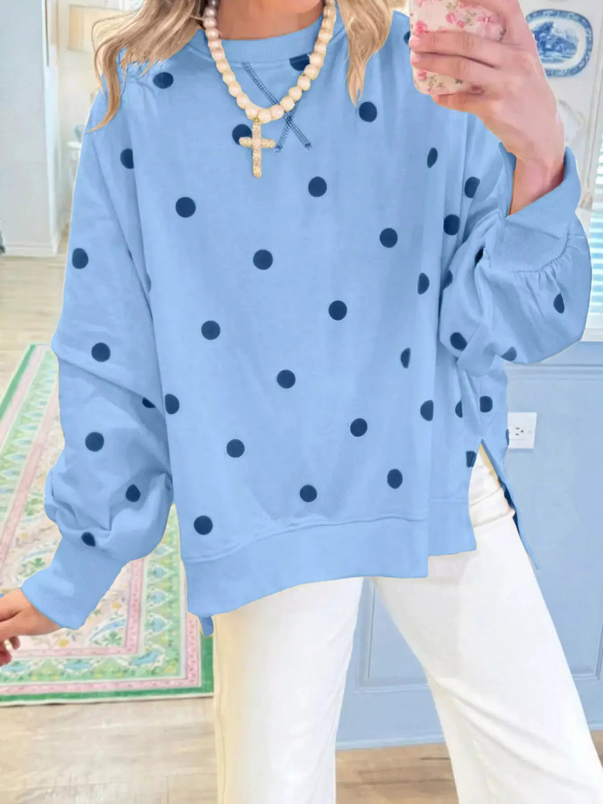 Side Slit Polka Dot Oversized Sweatshirt in light blue with navy polka dots; shown with pearl necklace and cross pendant