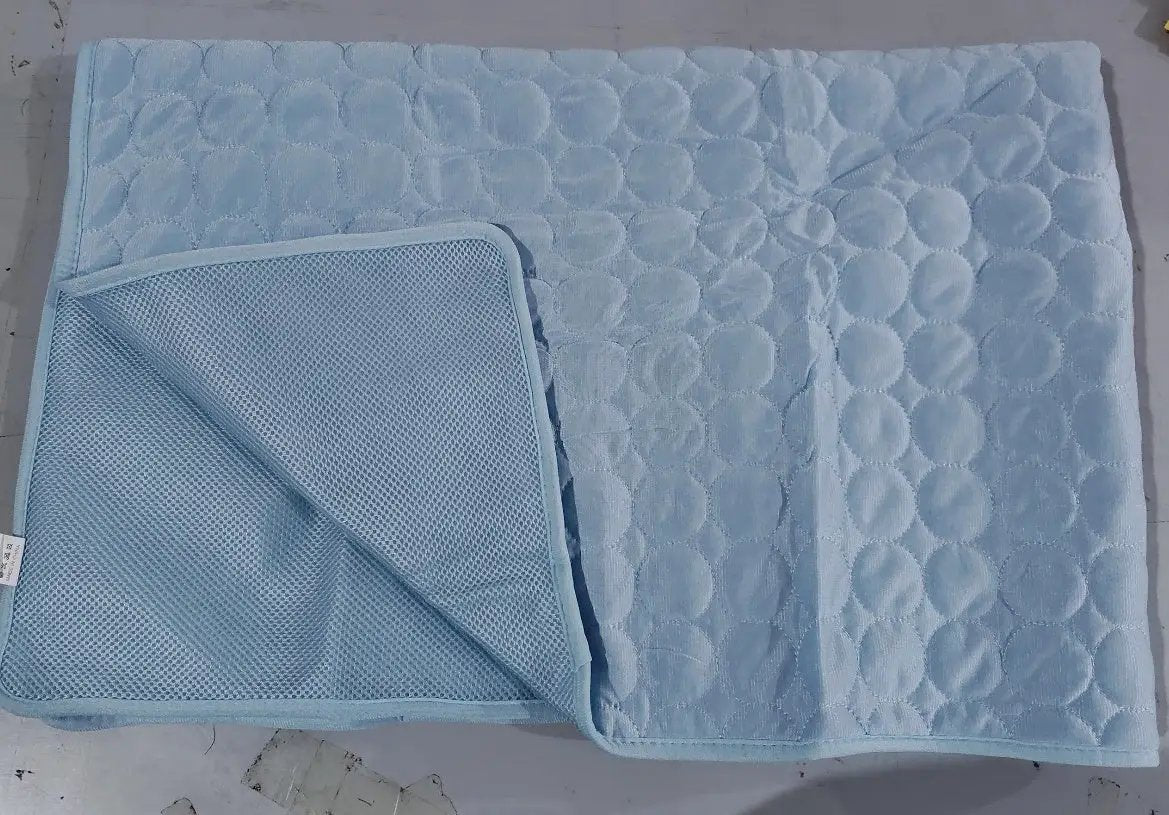 Summer Cooling Pet Sleeping Ice Silk Mat in light blue with quilted circle pattern, AdTec.