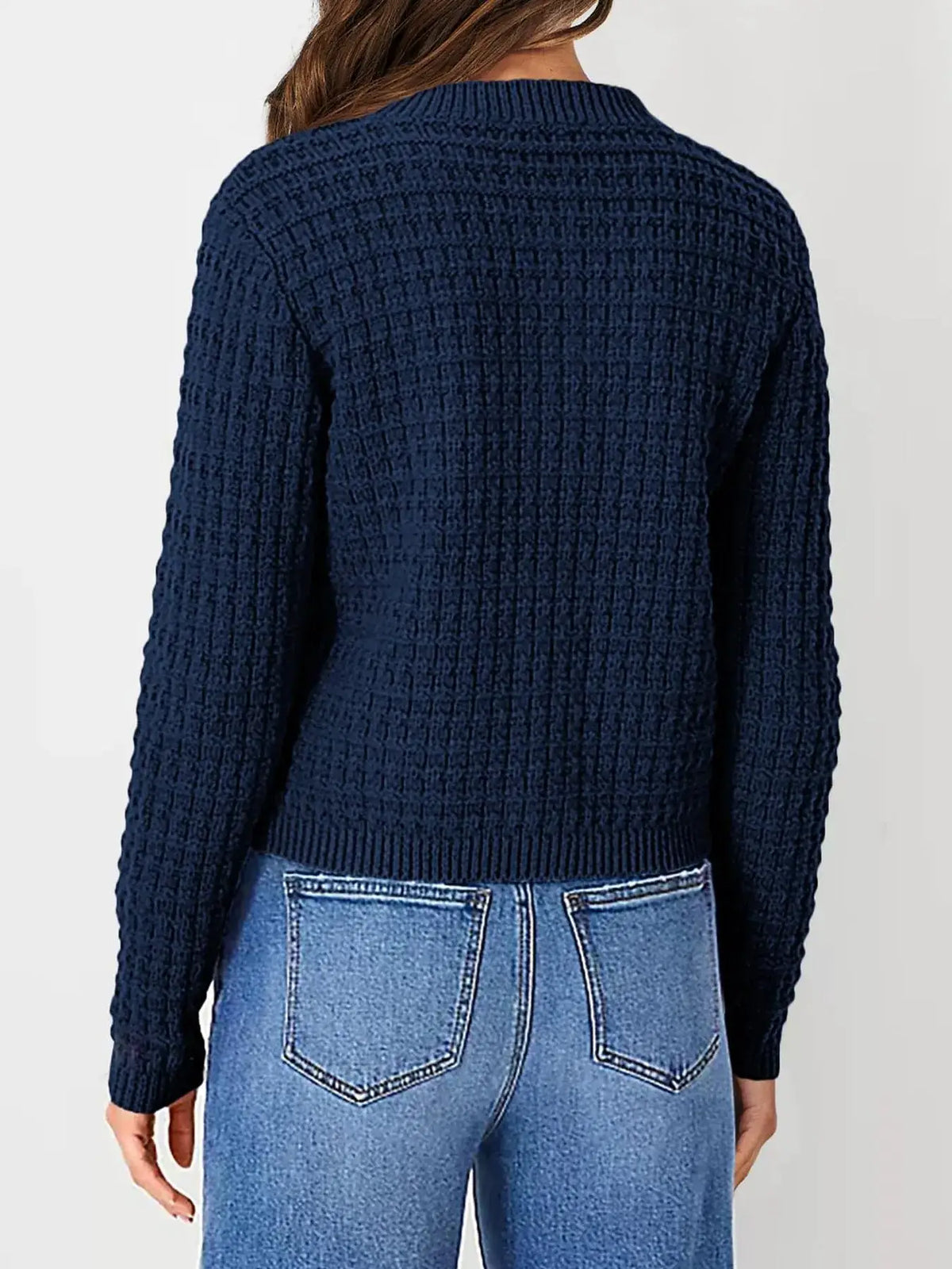 Textured stretchy knit cardigan in navy with ribbed cuffs and hem, back view.