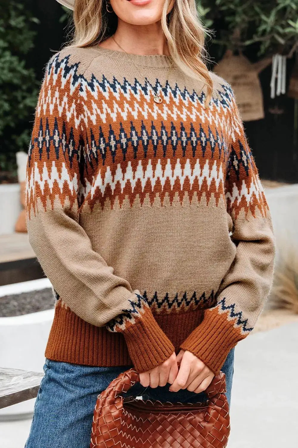 Geometric pattern long sleeve sweater; tan knit with orange and navy zigzag accents