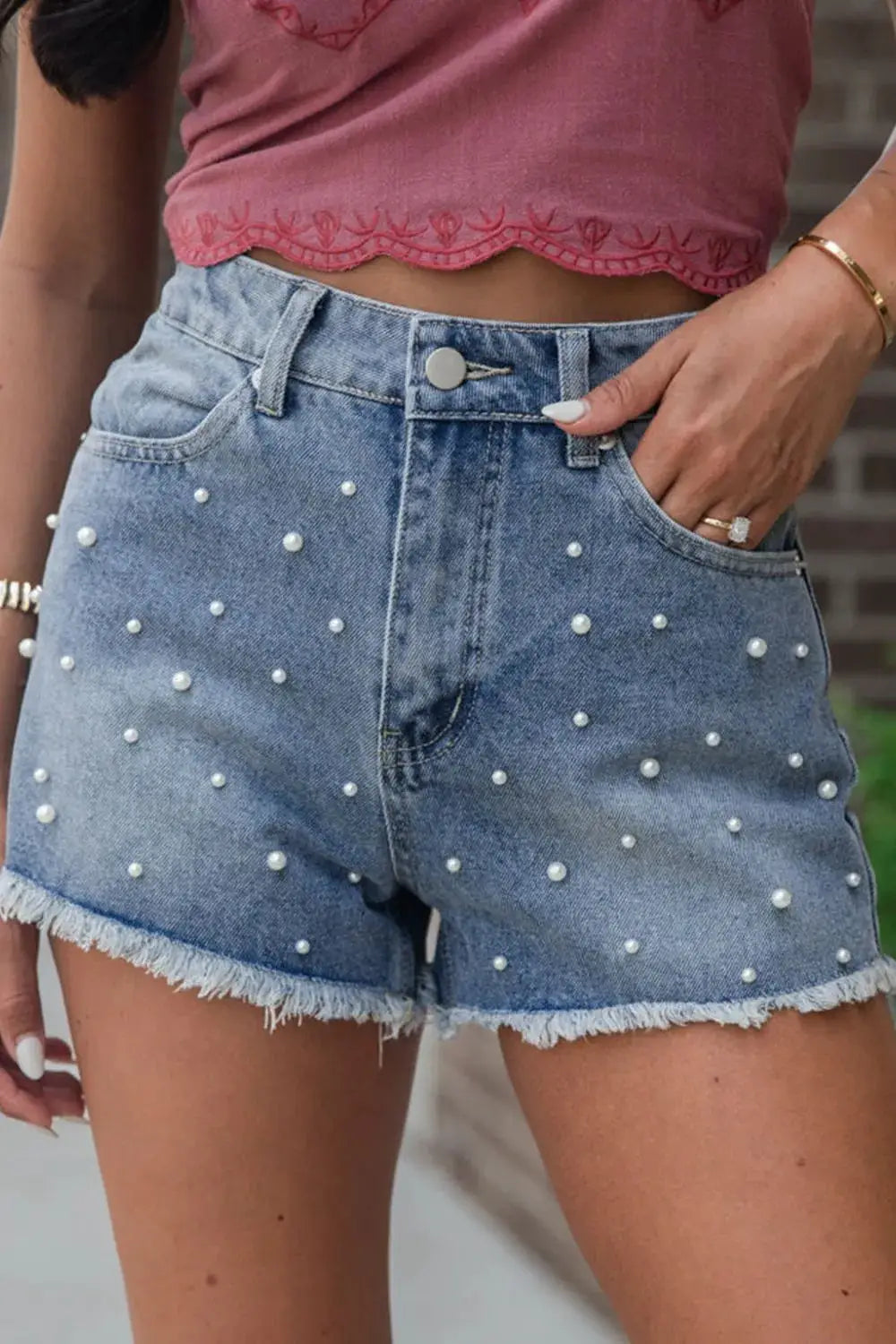 Classic Pearl Beaded Denim Shorts in light-wash cotton blend with a frayed raw hem by Trendsi