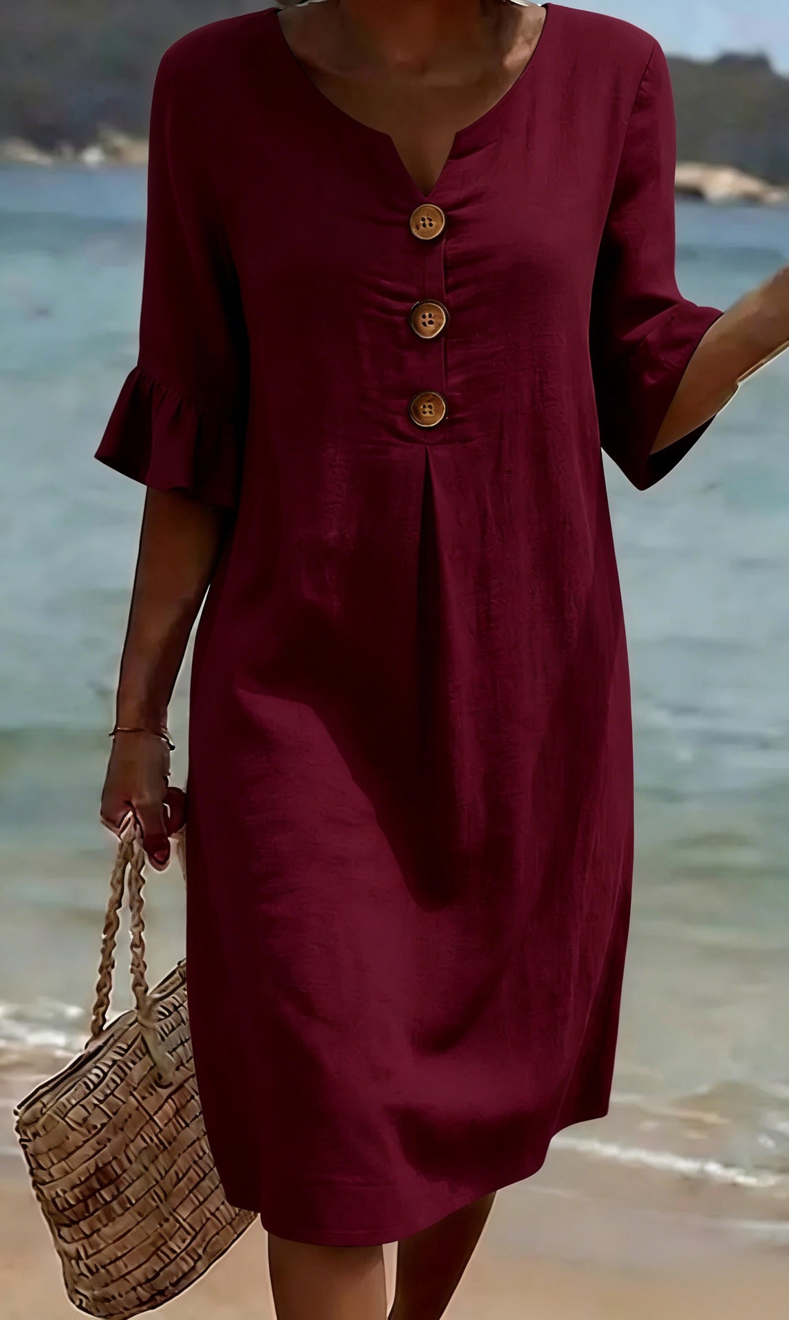 Summer Womens Solid Colored Cotton Dress in burgundy with wooden front buttons, beach scene