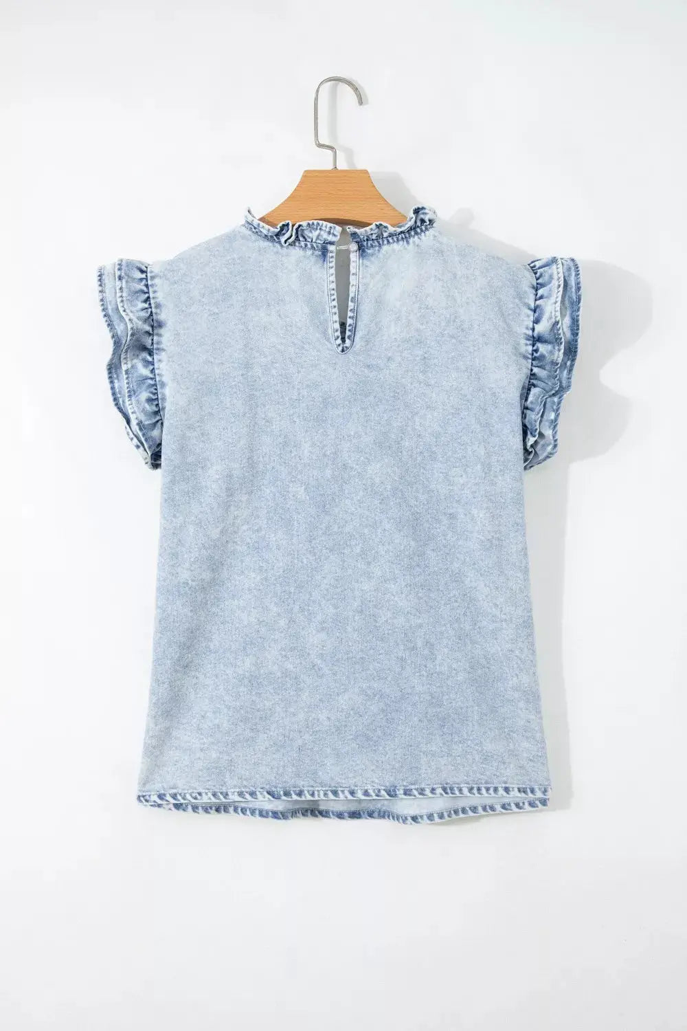 Blue denim top with vintage wash and delicate ruffle and pleats.