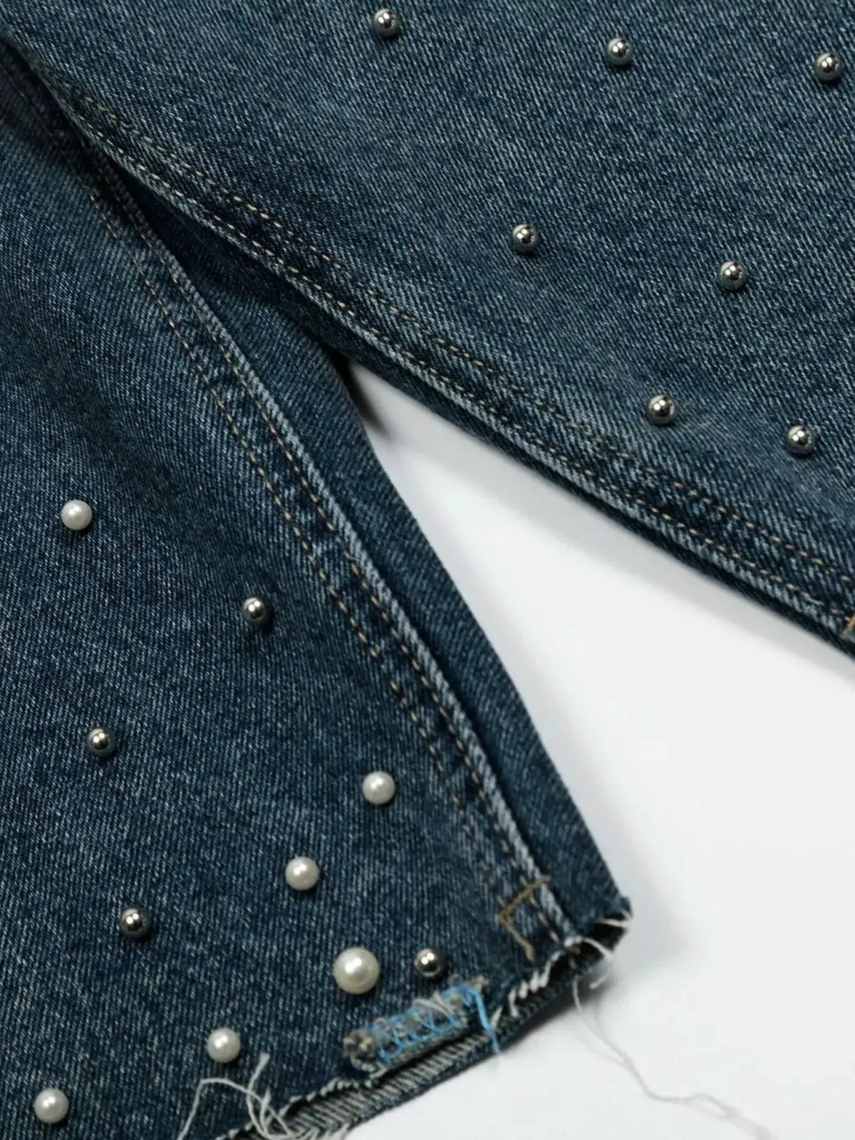 Men's relaxed wide-leg blue denim shorts with pearl studs and frayed hem in soft washed cotton